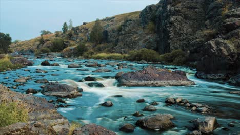 fast flowing mountain river with rocks