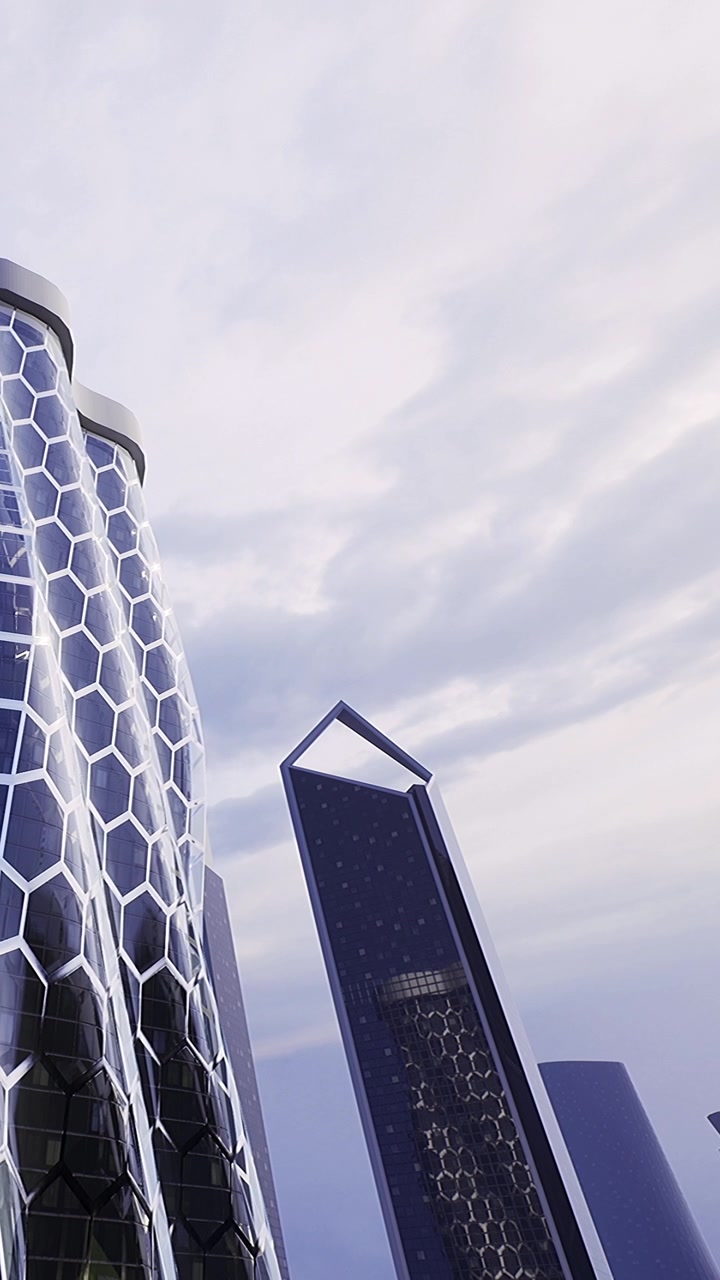 Edifici moderni si ergono alti contro un cielo nuvoloso in un contesto urbano.