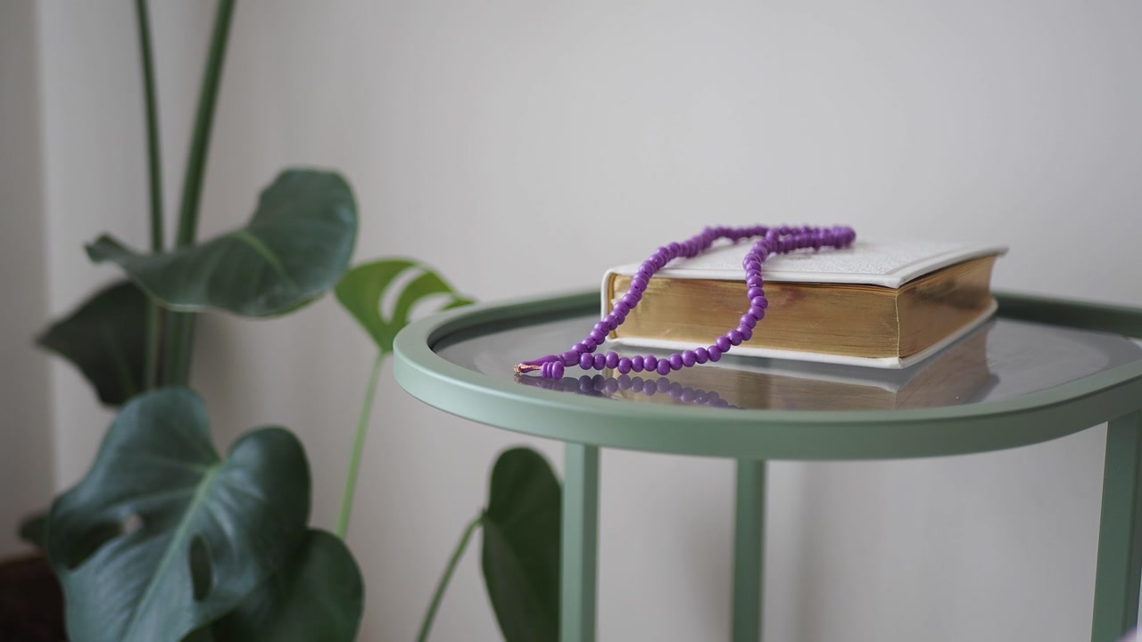 Islamic Holy Book and Prayer Beads on a Modern Side Table