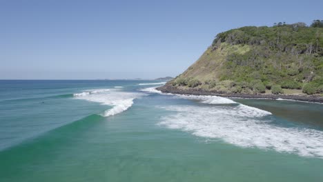 people surfing at burleigh heads in gold coast, queensland, australia - aerial drone shot