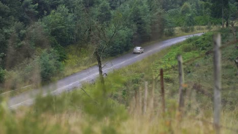 car driving down country lane