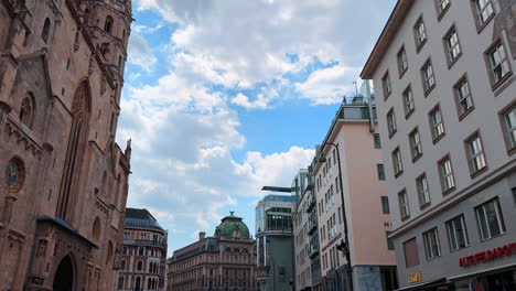 vienna, austria - june 9, 2025: tourist strolls historic wien. tourists explore the charming streets of wien, austria, surrounded by historic architecture and under a cloudy sky
