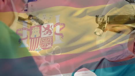 Animation-of-waving-spanish-flag-over-caucasian-female-surgeon-performing-surgery-at-hospital
