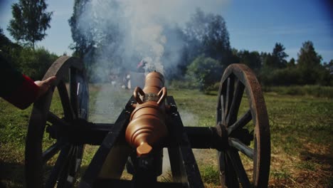 classic war cannon of napoleon times firing a bullet