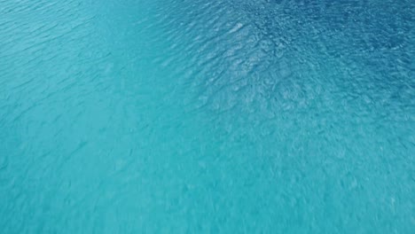 crystal clear blue water and empty beach