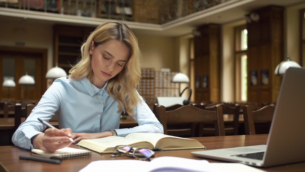 Woman studying in a library