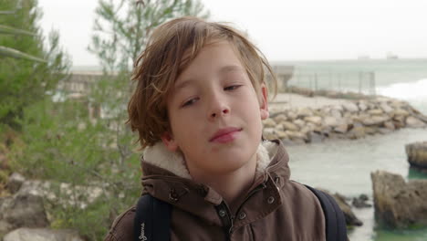 portrait of adolescent boy on the coast