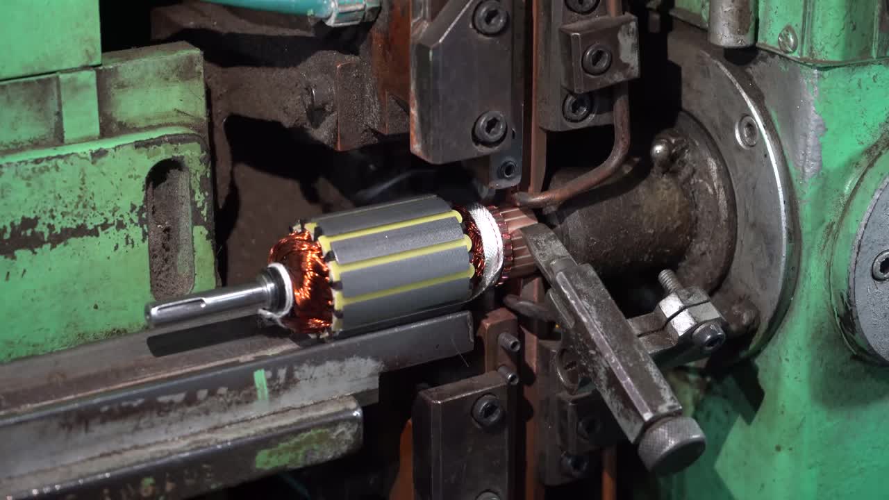 Armature used in motor manufacturing process being welded using a automated machine. Coil being welded to the core