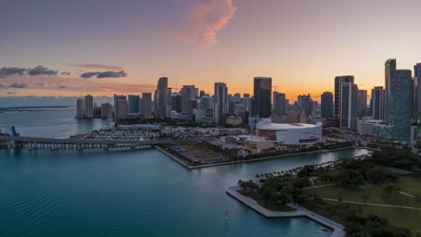 miami florida skyline in colourful twilight light, aerial drone hyperlapse, view towards kaseya center and brickell