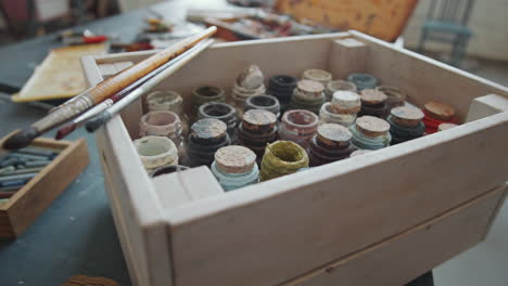 vintage paint box with brushes