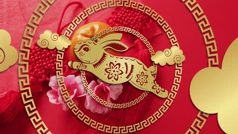 animation of chinese pattern and rabbit year decoration on red background