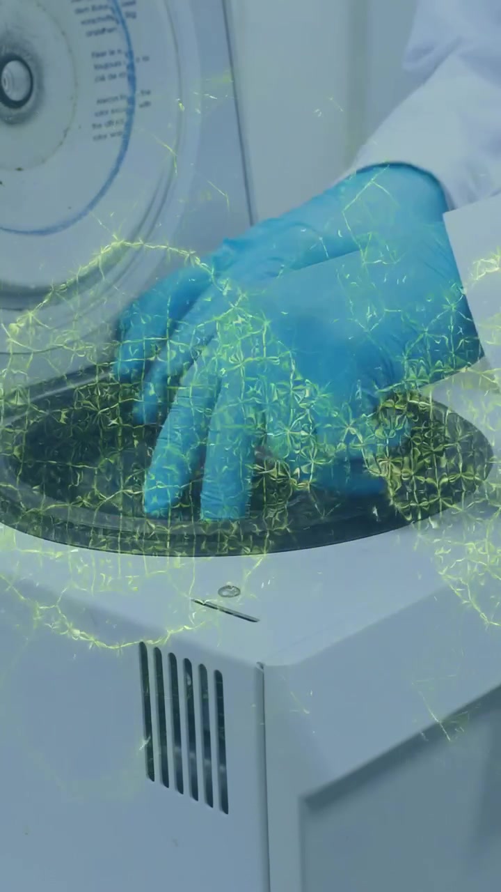 Vertical video: Gloved hand lifting lid, green net appearing, placing tubes, checking balance