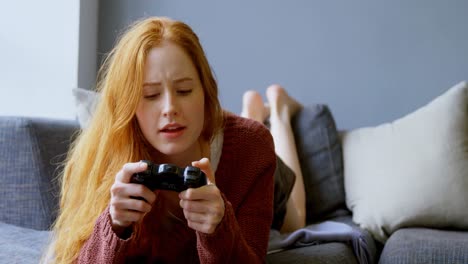 woman playing video games in living room 4k