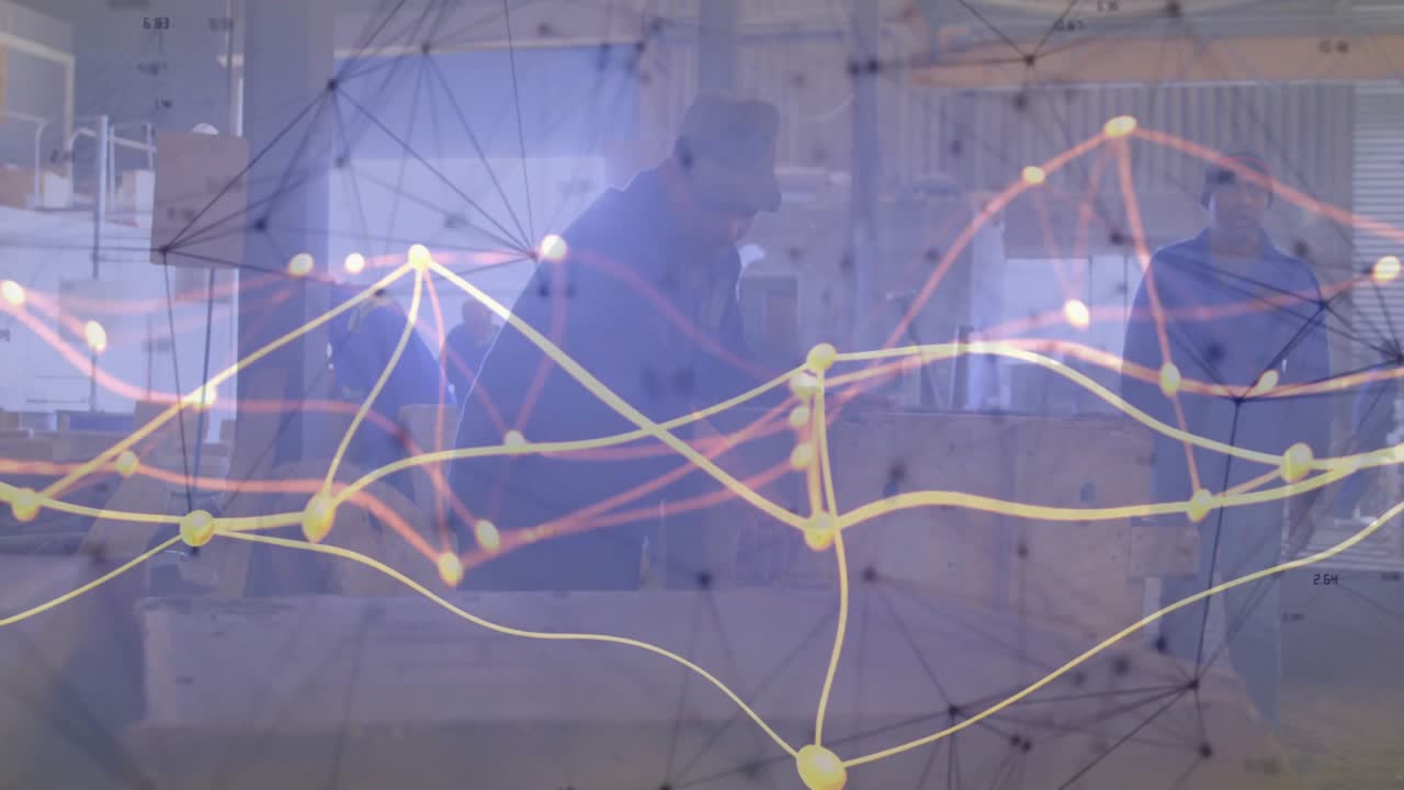 Team di ingegneri che disimballa progetti, posizionando un tablet che mostra un grafico di rete sovrapposto che visualizza dati.