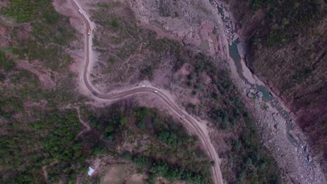 An-Asian-river-with-beautiful-green-mountains-and-a-rough-road