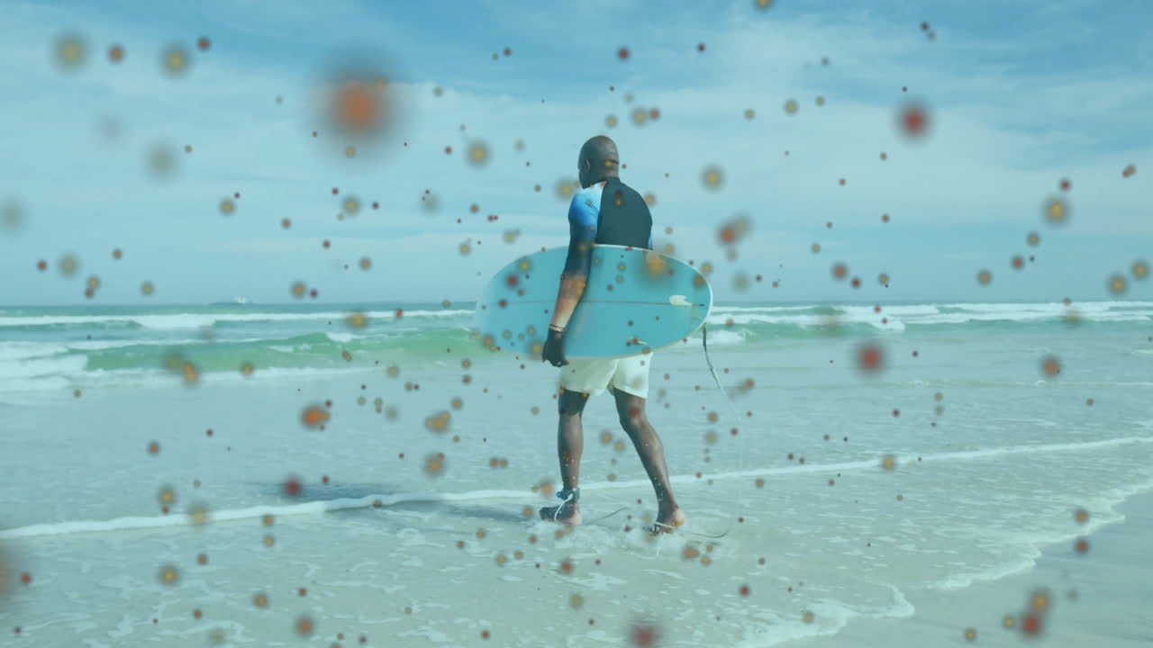 Surfer carrying board on beach with colorful abstract animation overlay