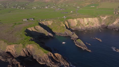 dunquin pier, with dramatic skies and sea views - dingle co.kerry - 4k cinematic drone footage 03