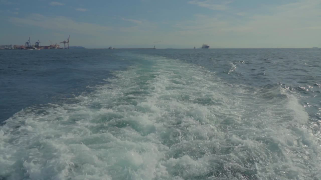 WAVES BACK OF THE FERRY, CLOUDY AND BLUE SKY, BOSPHORUS, ISTANBUL, TURKEY