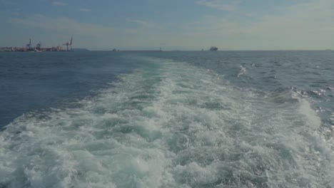 waves back of the ferry, cloudy and blue sky, bosphorus, istanbul, turkey