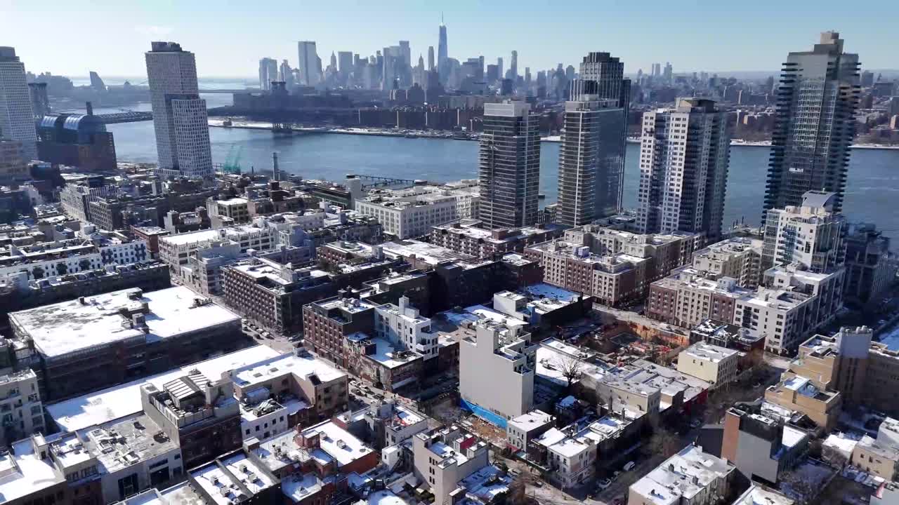 Horizontal drone orbit shot over Wythe Ave in Williamsburg, Brooklyn, showcasing New York’s vibrant streets, iconic architecture, and dynamic skyline with a smooth aerial rotation.