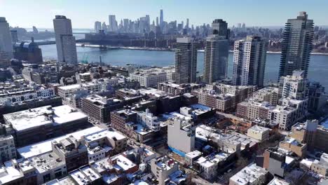 horizontal drone orbit shot over wythe ave in williamsburg, brooklyn, showcasing new york’s vibrant streets, iconic architecture, and dynamic skyline with a smooth aerial rotation.