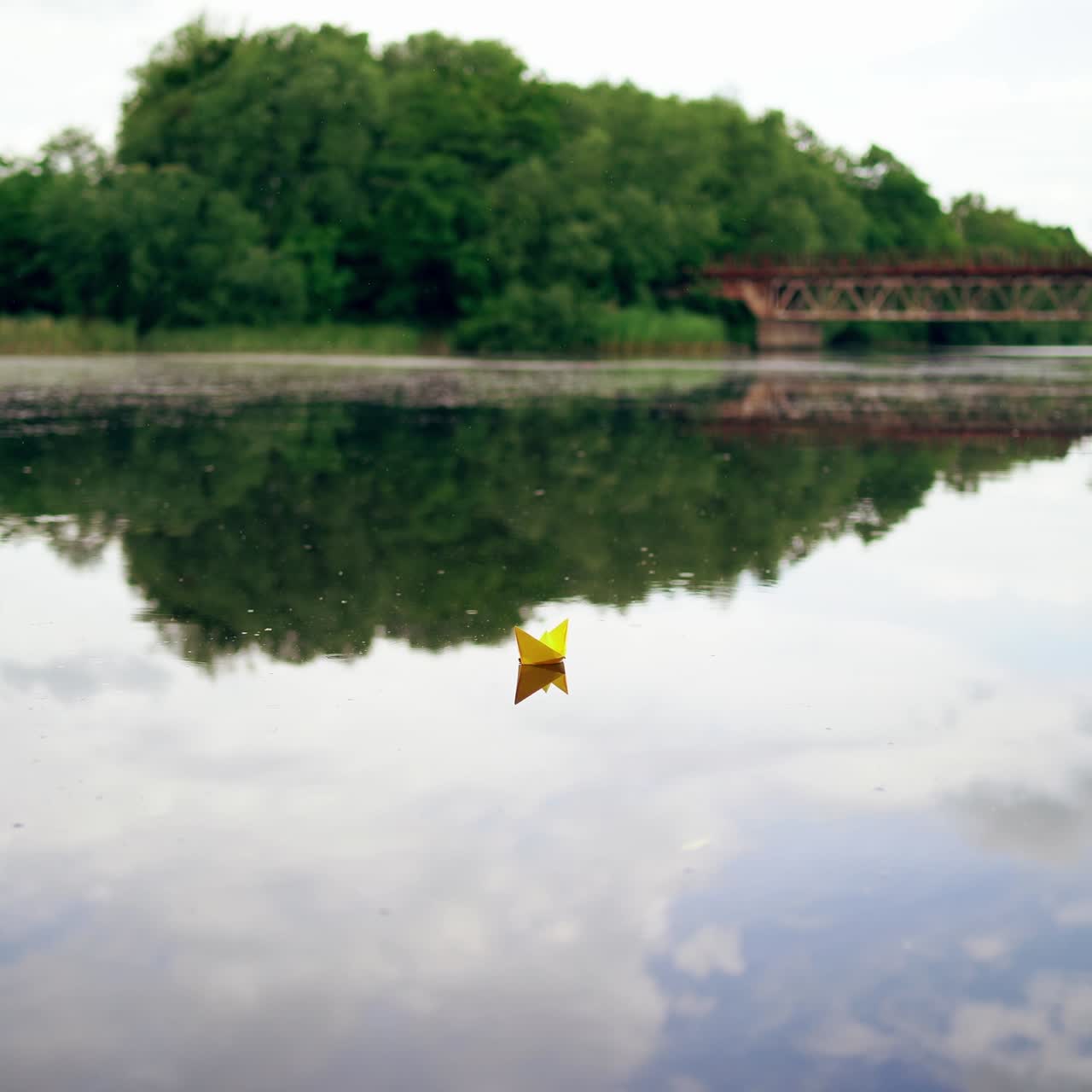 Toy boat of paper in the water