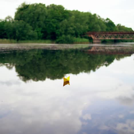 toy boat of paper in the water