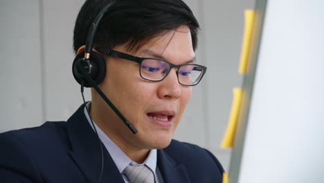 business people wearing headset working in office