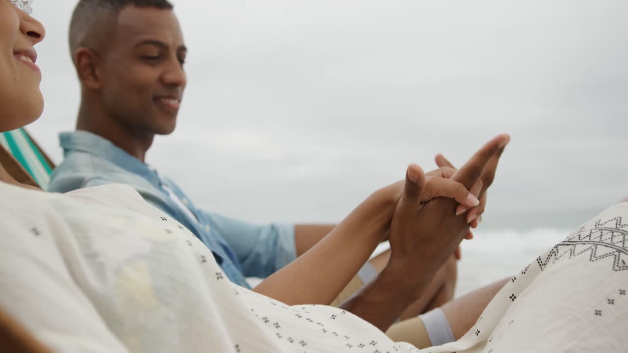 Couple enjoying free time by the sea