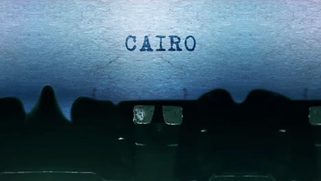 cairo word closeup being typing and centered on a sheet of paper on old vintage typewriter