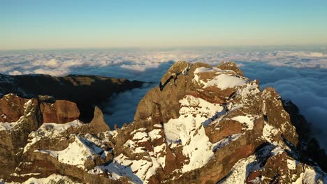 aerial shot of the snowy peak of the mountain pico ruivo in madeira