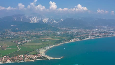 pull out aerial shot overlooking the amazing apuan alps and the unique carrara marble quarry