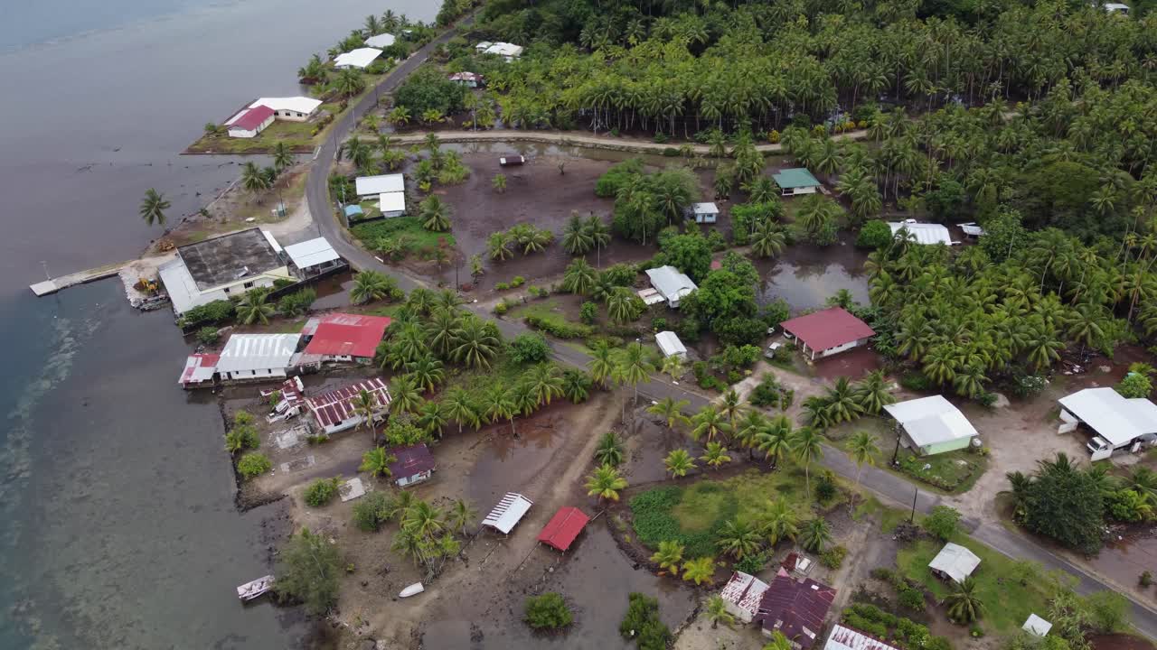 Aerial rotates over wet tropical coastline of Taha'a Island, Polynesia