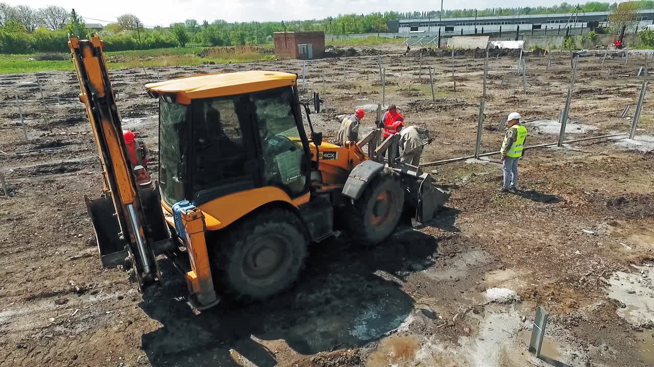 Construction site shot from above. Aerial view of construction worker in construction site