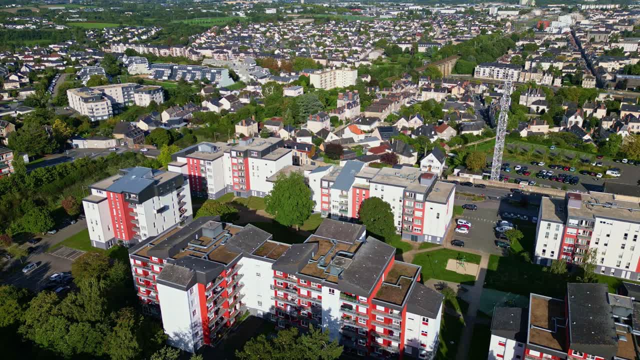 Modern neighborhood in Laval, urban development concept, France. Aerial drone backward