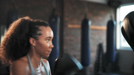 boxer, sports gym and woman punch training