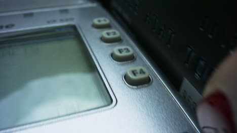 closeup woman hand with credit card swiping through pos terminal for sale