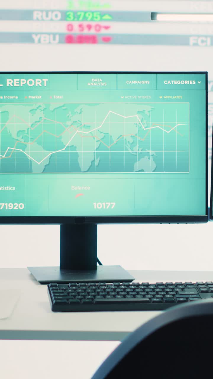 Computer Monitors Displaying Financial Data and Stock Market Charts