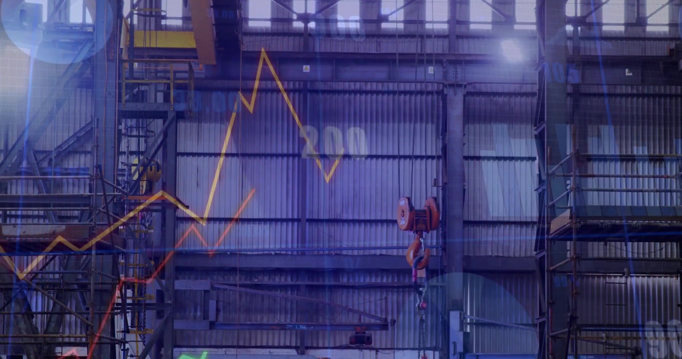 On empty warehouse interior, line graphs emerging then rising and dipping to show production trends