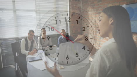 Animation-of-clock-moving-over-diverse-colleagues-talking-in-office