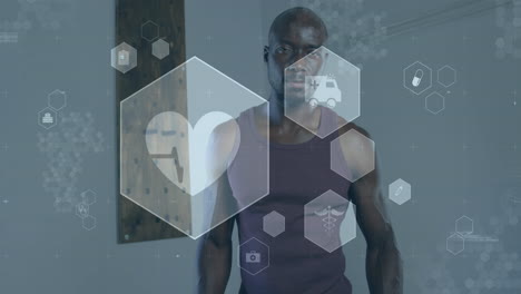 animation of medical and health icons over african american man exercising in gym