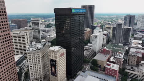 Fly-around-group-of-tall-modern-downtown-towers