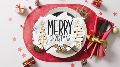 Animation-of-christmas-greetings-text-over-christmas-place-setting-and-decorations