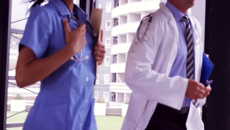 doctor and nurse running together