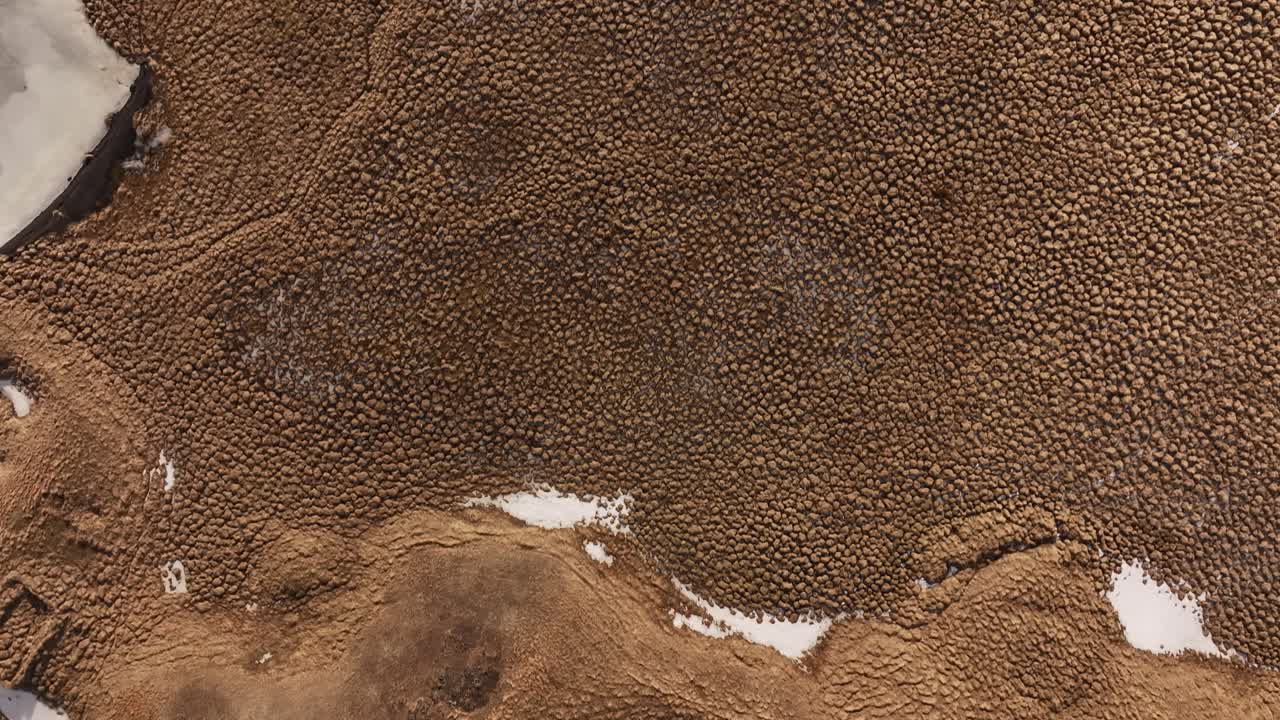 Fast-moving aerial view over a volcanic crater in Skútustaðir near Lake Mývatn, Reykjahlíð, Iceland.