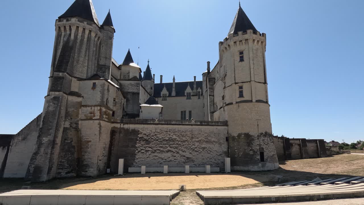 Historic Saumur Chateau castle rises into blue sky in Loire, France