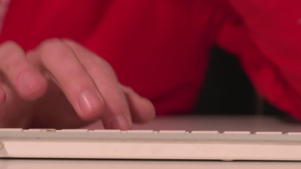 Hands nervously typing on computer keyboard