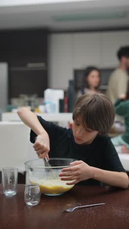 boy baking with family
