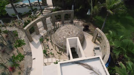 Aerial-over-architectural-detail-of-luxurious-villa-located-at-the-mesmerizing-coastline-in-Huatulco,-Mexico