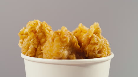 fried chicken in a paper cup